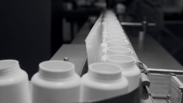 Production,Of,Dietary,Supplements.,White,Plastic,Cans,For,Tablets,On Production,Of,Dietary,Supplements.,White,Plastic,Cans,For,Tablets,On